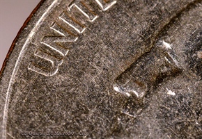 2:1 Macro of a coin using a  Loawa 100mm macro lens