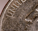 2:1 Macro of a coin using a  Loawa 100mm macro lens